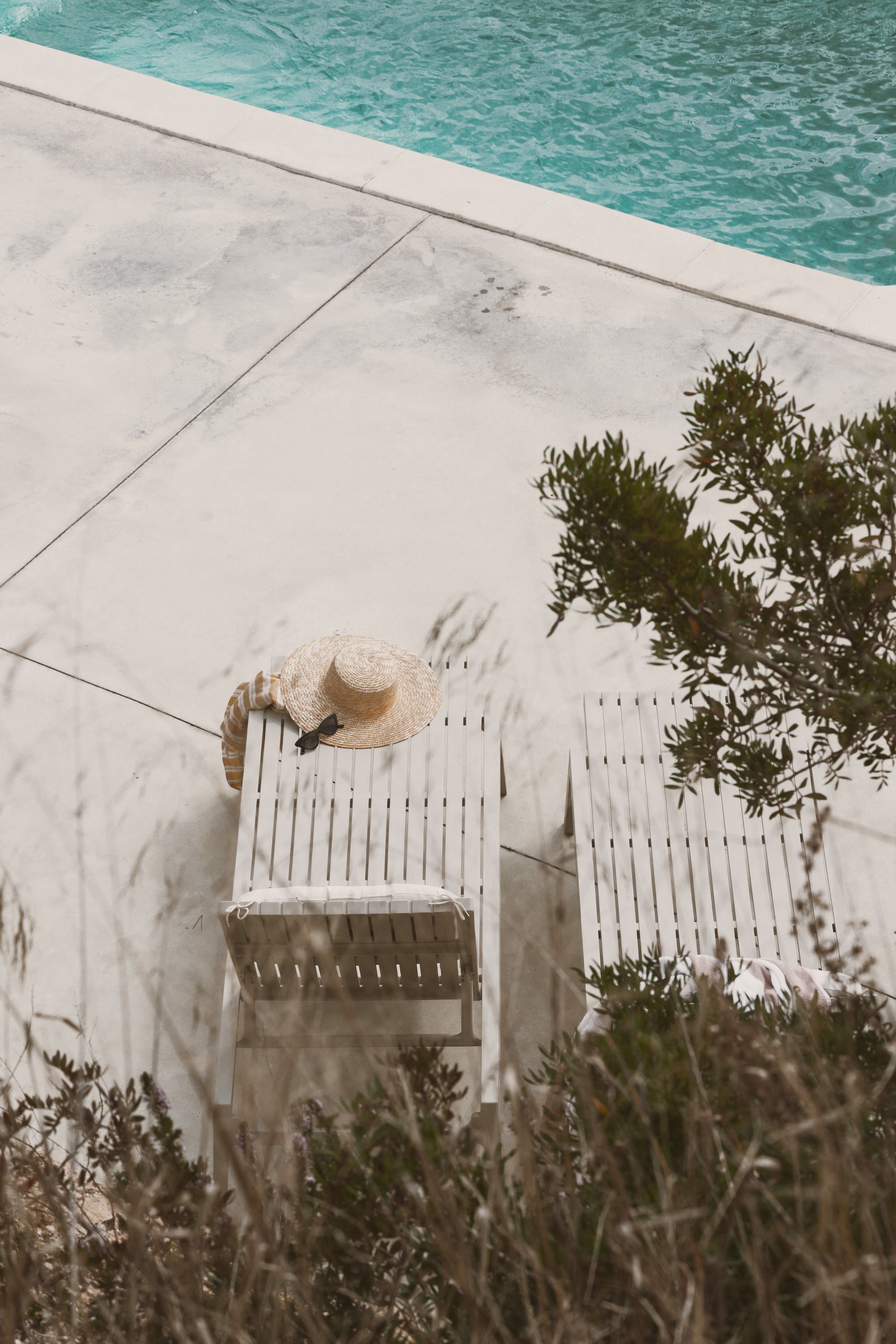 Pool Lifestyle Lounge Chairs by a Pool