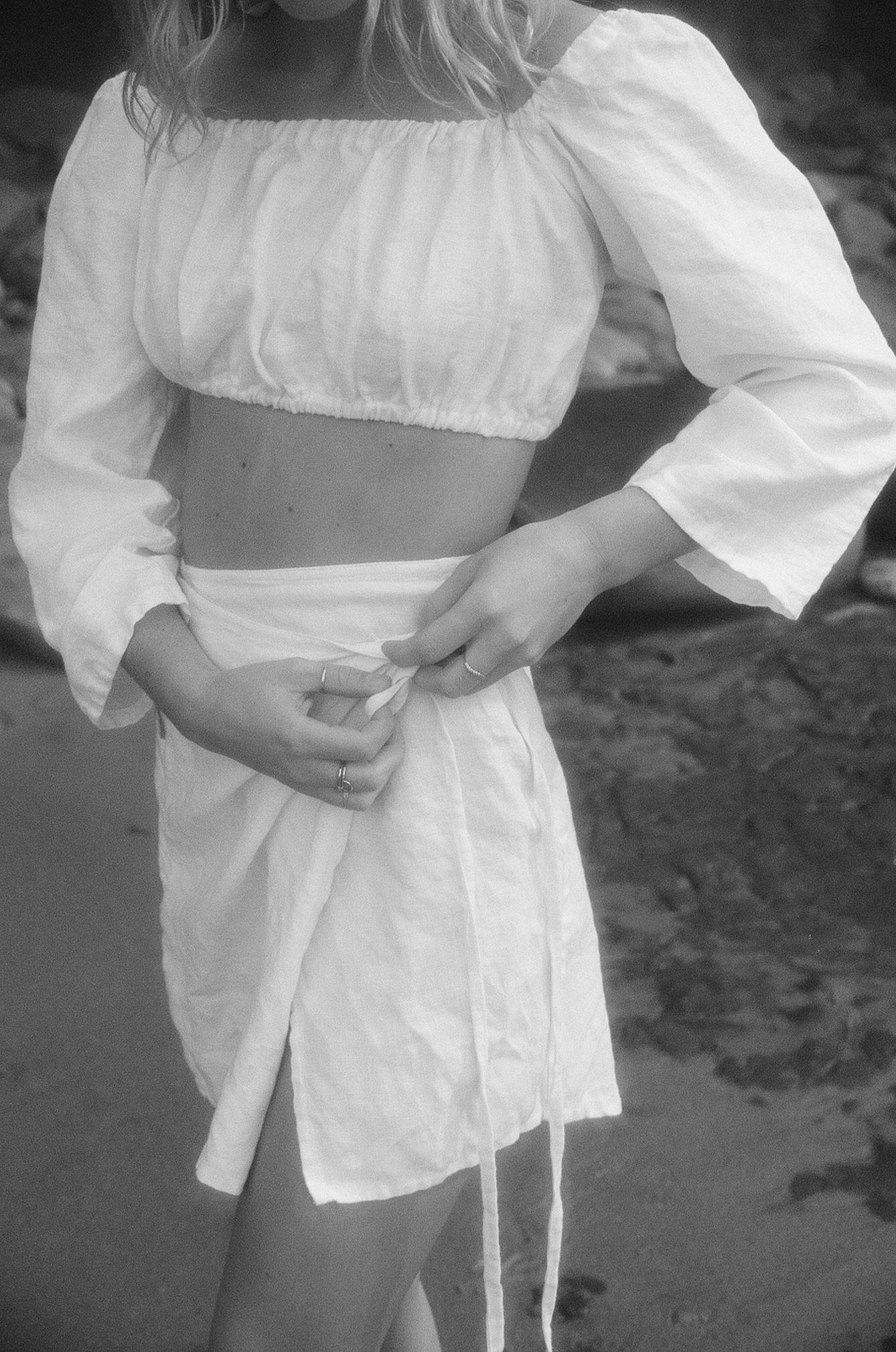 Monochrome Photo of a Woman in White Beach Outfit